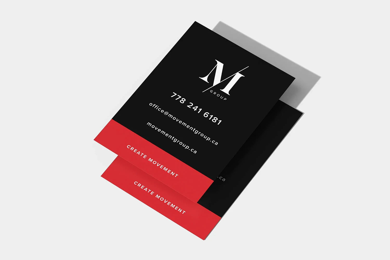 Movement Group office signage — white on black with red call-out
